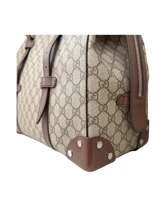 Gucci monogrammed canvas bag with leather trim from Elegant in Monogram Gucci Tote Bliss Meets Supreme Tote Charm
