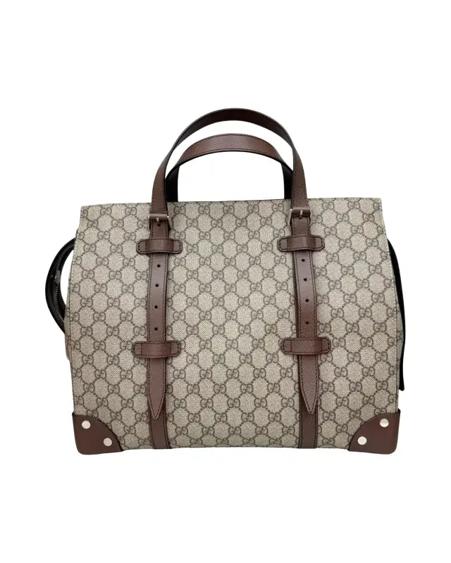 Gucci monogrammed tote bag with brown leather straps, perfect for supreme tote fans